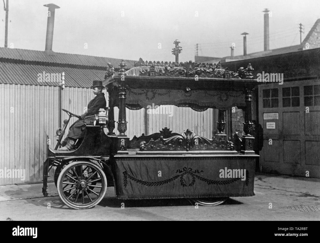 An electrically driven, open funeral car. Stock Photo