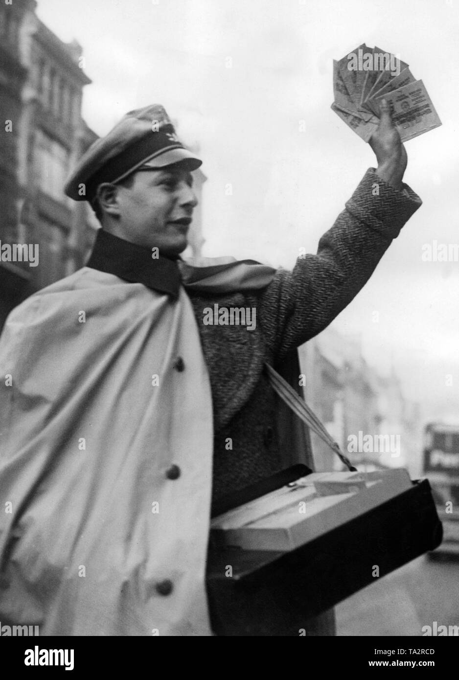 A ticket seller for the lottery of the Nazi Winter Relief. Stock Photo