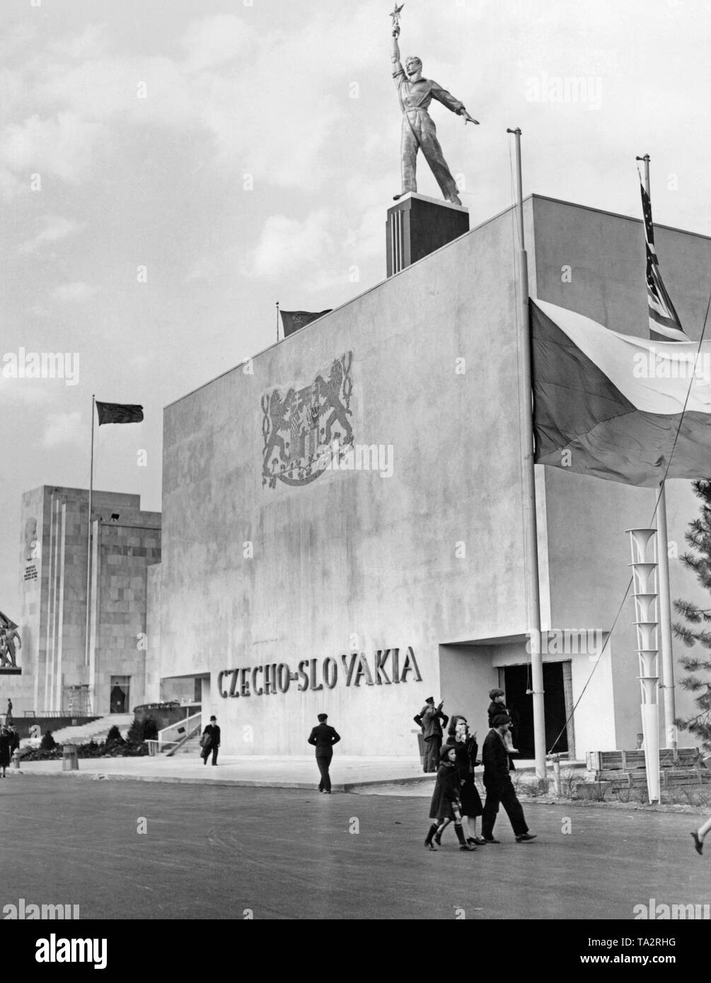 The Czechoslovak Pavilion at the World's Fair in New York, 1939. The flag of Czechoslovakia is drawn up at half-mast. In May 1939, the Pavilion remains closed. In March 1939, Slovakia split from the Czech Republic on Hitler's command, and Bohemia and Moravia were occupied by the German troops. Stock Photo