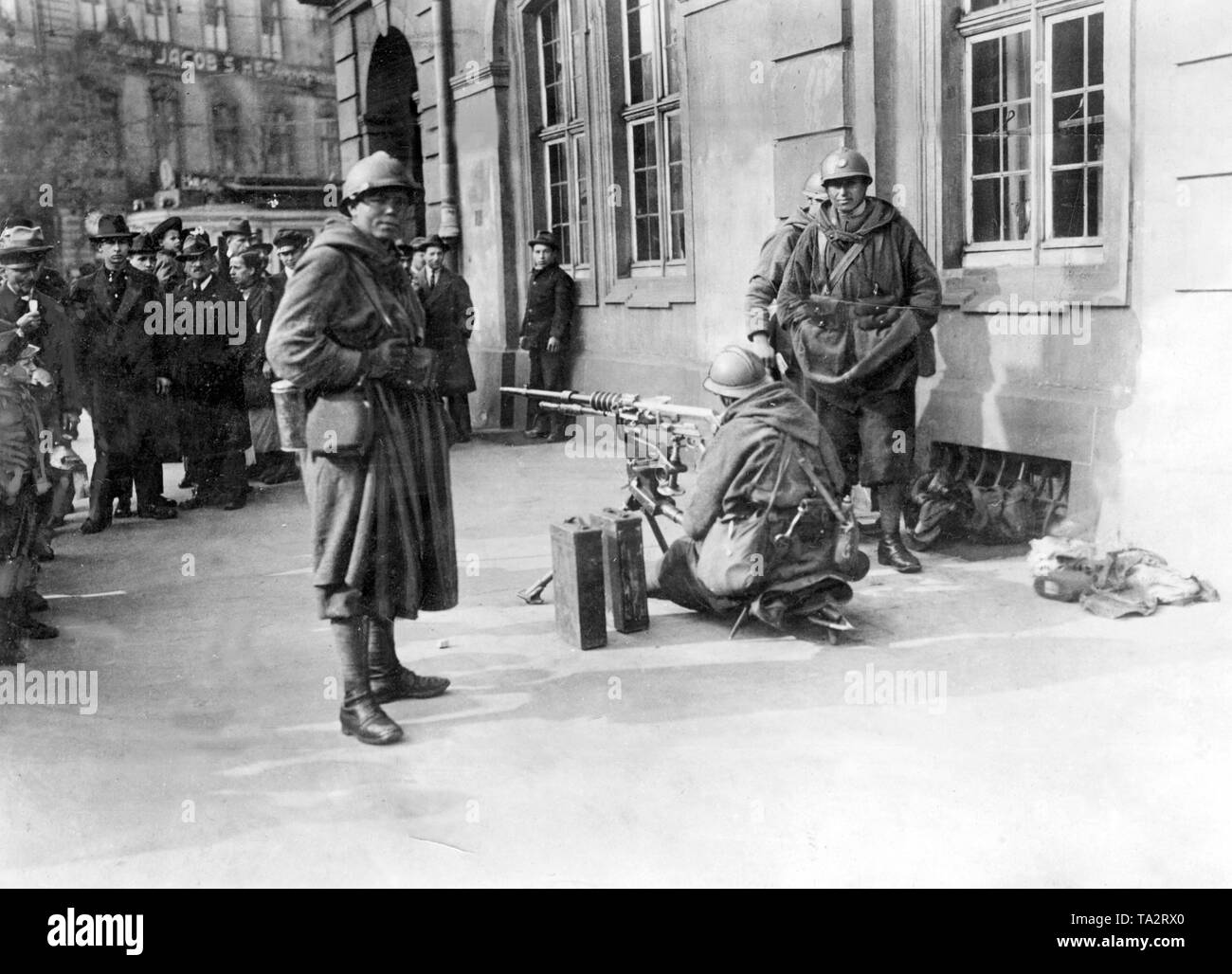 French soldiers, as part of the Allied  occupation army, have set up a machine gun in front of the main guard (Undated photo). Stock Photo