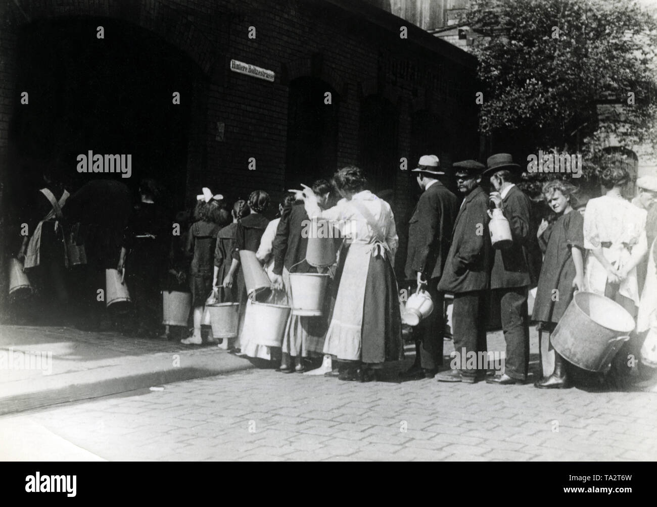 Shortage of water was not a rarity during the Polish uprisings in Upper Silesia. Like these Katowice inhabitants, many had to take care of their water supply (Undated photo). Stock Photo