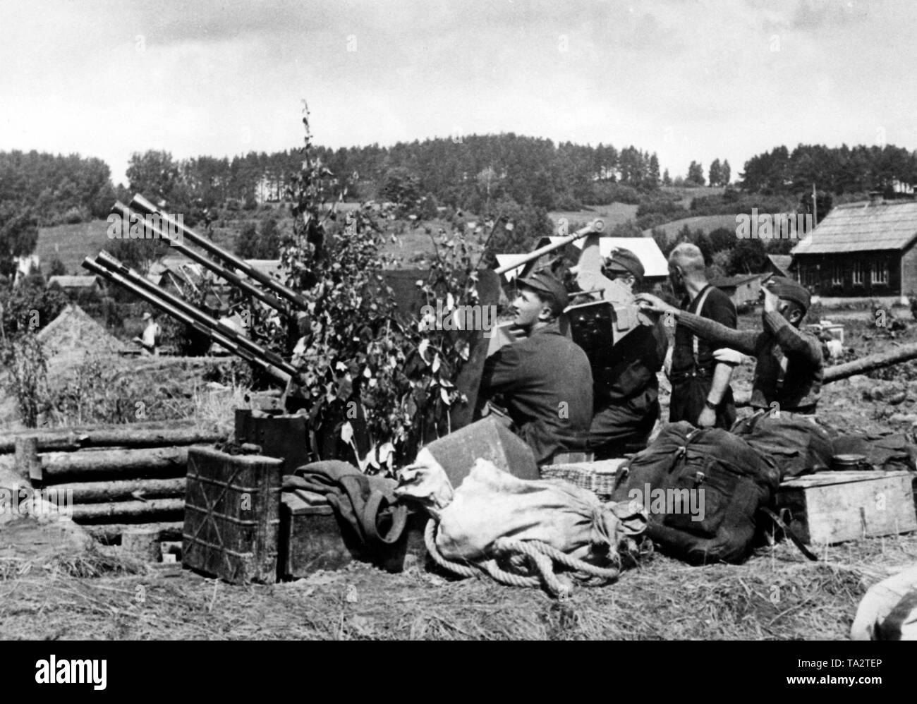 German antiaircraft bombardiers stand guard in the area of river Daugava with their 2-cm Flak Vierling 38. Photo of the Propaganda Company (PK): war correspondent Kamm. Stock Photo