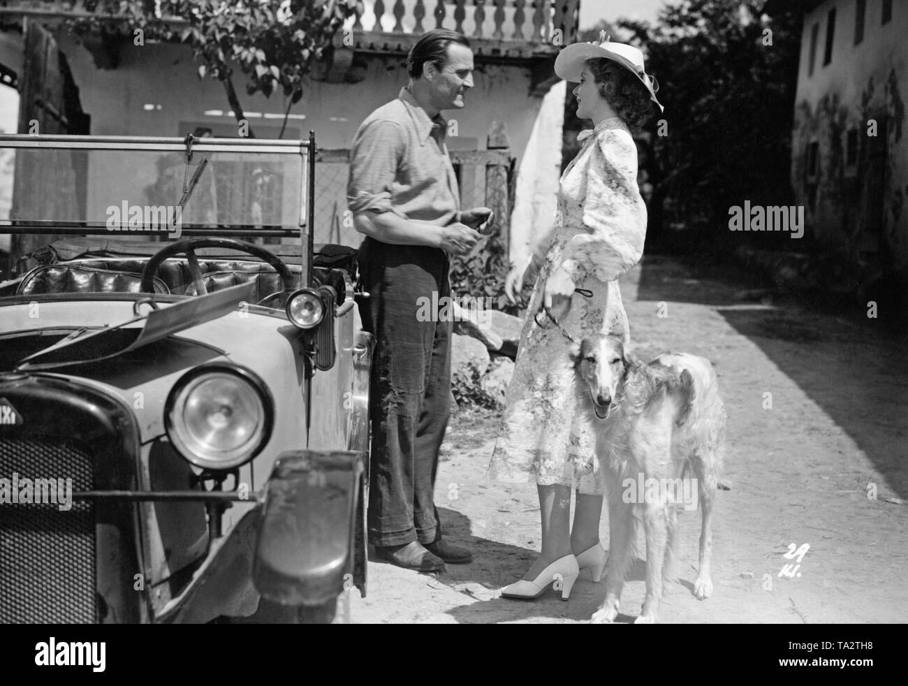 Still from the UFA film 'Three Fathers for Anna' from 1939. Left, a BMW Dixi 3/15 Cabriolet. Stock Photo
