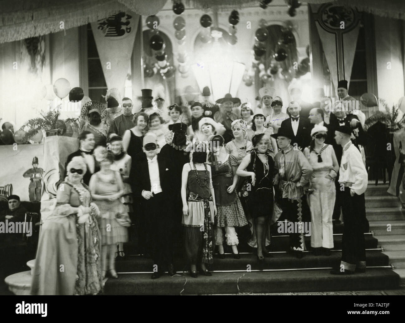 View of participants of the masked ball of ADAC in the Kaiserhof in Berlin. Stock Photo