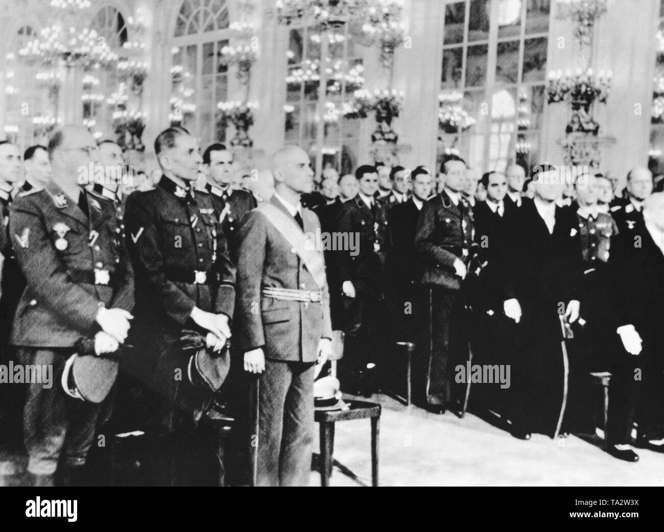 After the assassination of Reinhard Heydrich, Wilhelm Frick (3rd from left ) is appointed Reich Protector for Bohemia and Moravia.The celebrations take place in the Spanish Hall of Prague Castle. To Frick's left, SS-Obergruppenfuehrer Karl Hermann Frank and on the right, President Emil Hacha. Stock Photo