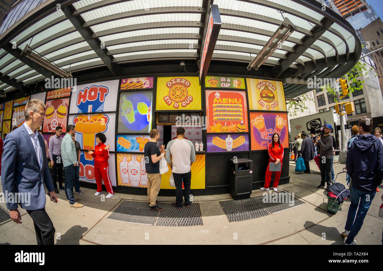 Participants line up to to be filmed trying samples of products from the fictional company “Buy n Large”, in Midtown Manhattan in New York on Wednesday, May 8, 2019. “Buy n Large” is a fictional company used in several of Pixar films including “WALL-E”.  (© Richard B. Levine) Stock Photo