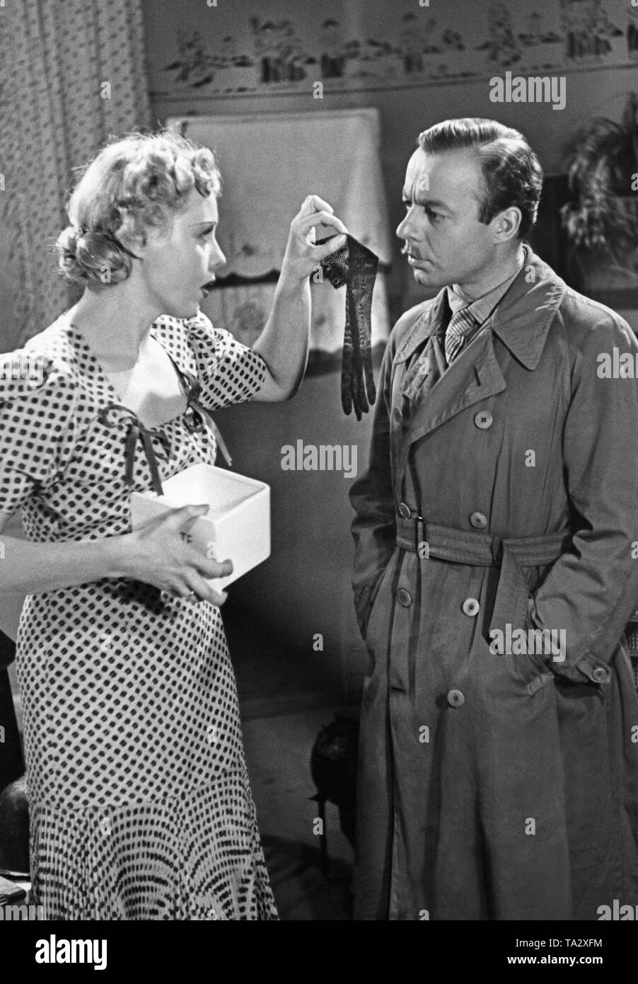 Heinz Ruehmann as Hermann Knittel and Anny Ondra as Erika Knittel in the movie 'The Gasman' by Carl Froehlich, based on the eponymous novel by Heinrich Spoerl. Stock Photo
