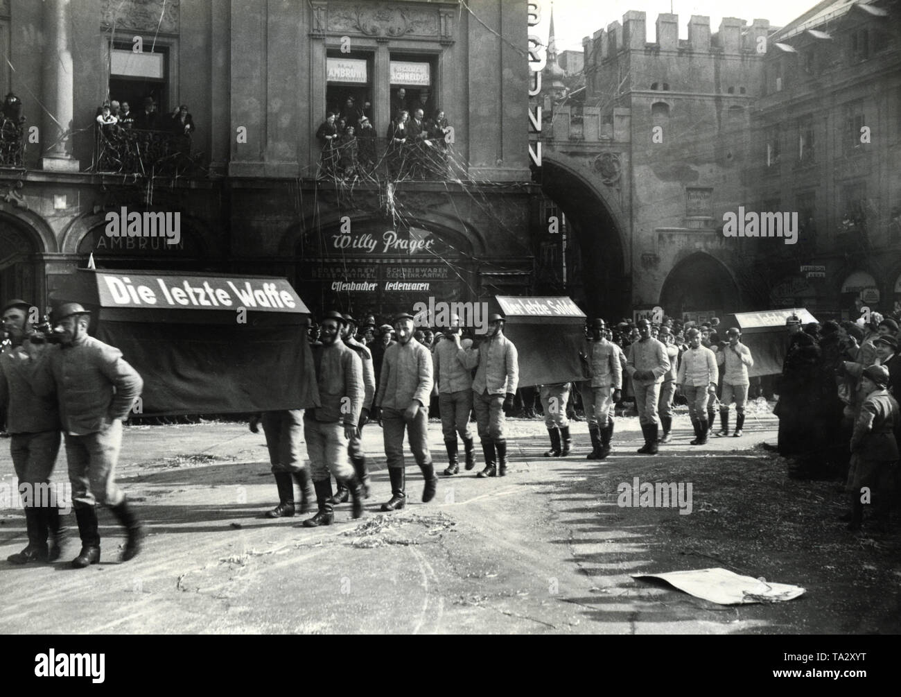 At the large carnival parade through the city center, the disarmament conference was also humorously depicted.The remains of the last weapon and the last soldier are carried to the grave (Undated photo). Stock Photo