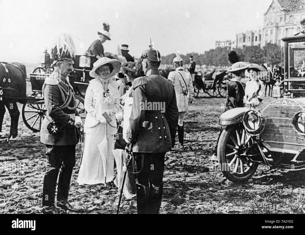 Emperor Wilhelm II in parade uniform on the Tempelhofer Feld in Berlin. Right in the picture, a Mercedes sedan. Stock Photo