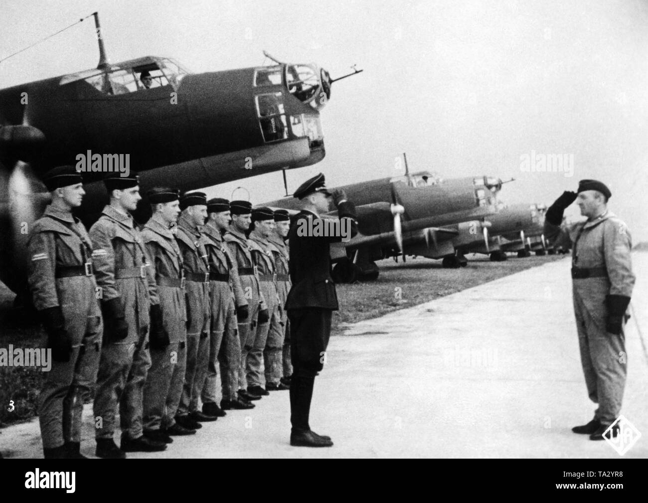 Last report of a bombing squadron before the launch, in the background stand their aircrafts of the type Junkers Ju 86. It is a picture from the Nazi propaganda film 'Flieger, Funker, Kanoniere' from 1937. Stock Photo