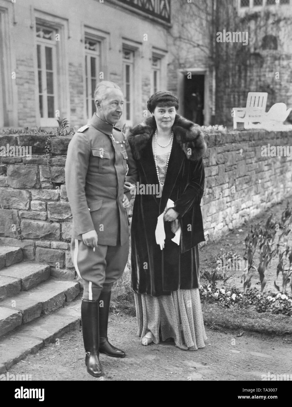 Crown Prince Wilhelm of Prussia with his wife Crown Princess Cecilie of Mecklenburg in front of Cecilienhof Palace. The picture was taken on the 50th birthday celebration of Crown Prince Wilhelm. Stock Photo