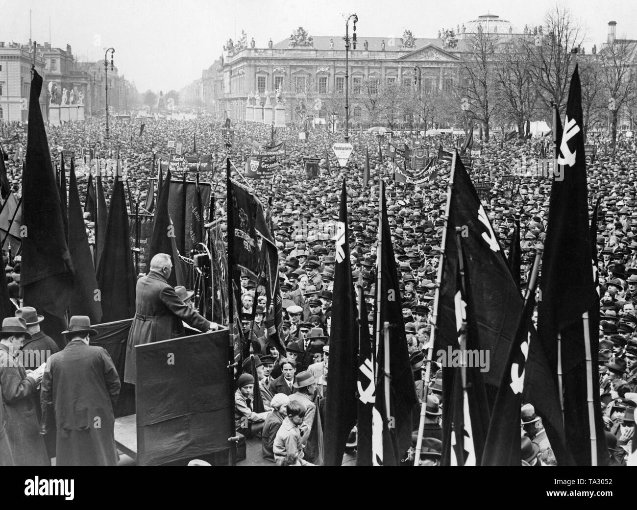 Trade union rally on 1 May, 1930. Numerous control services are present with their Socialist party flags. SPD party leader Otto Wels is holding a speech. Stock Photo