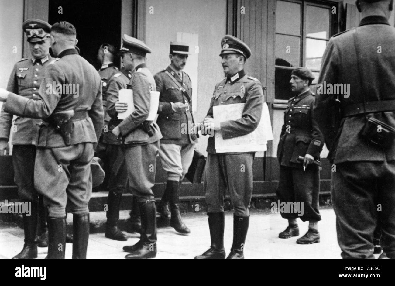 Officers of both sides at the end of the surrender negotiations in the Bitsch camp. Photo: Maes Stock Photo