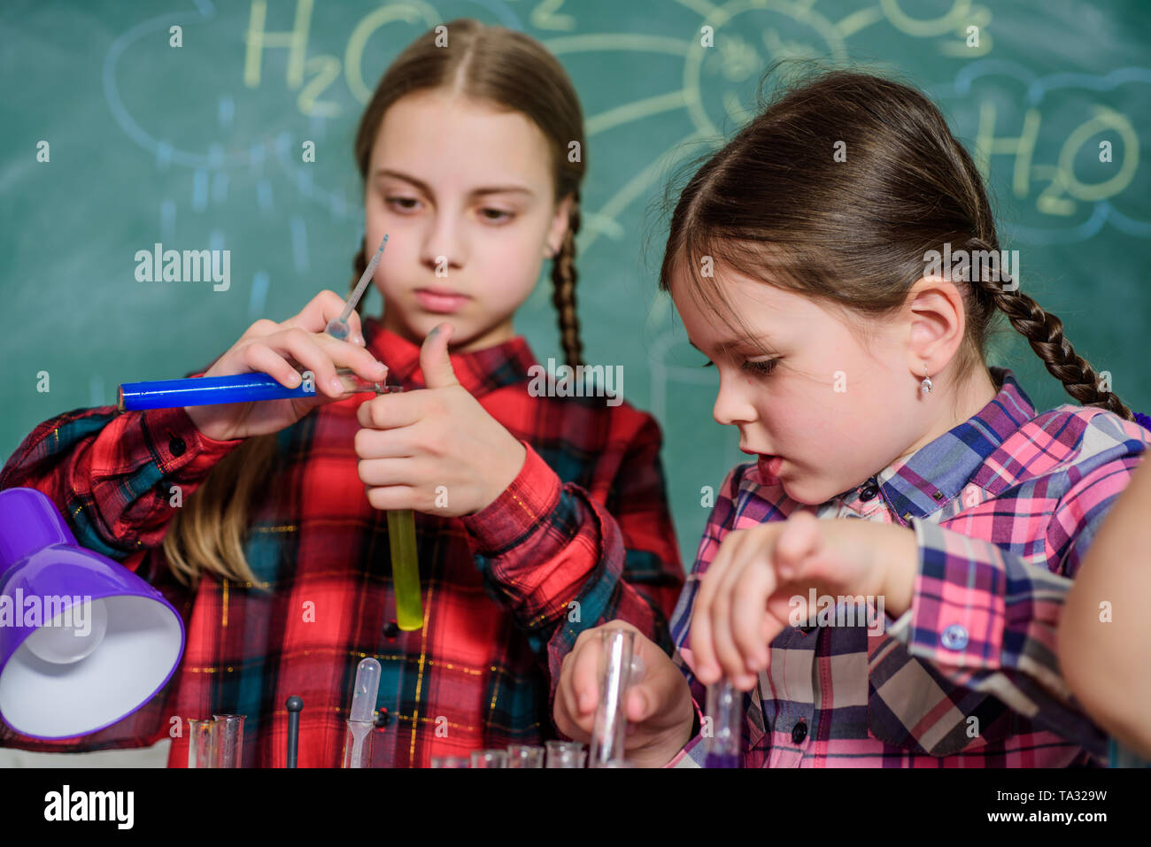 School classes. Kids adorable friends having fun in school. School chemistry lab concept