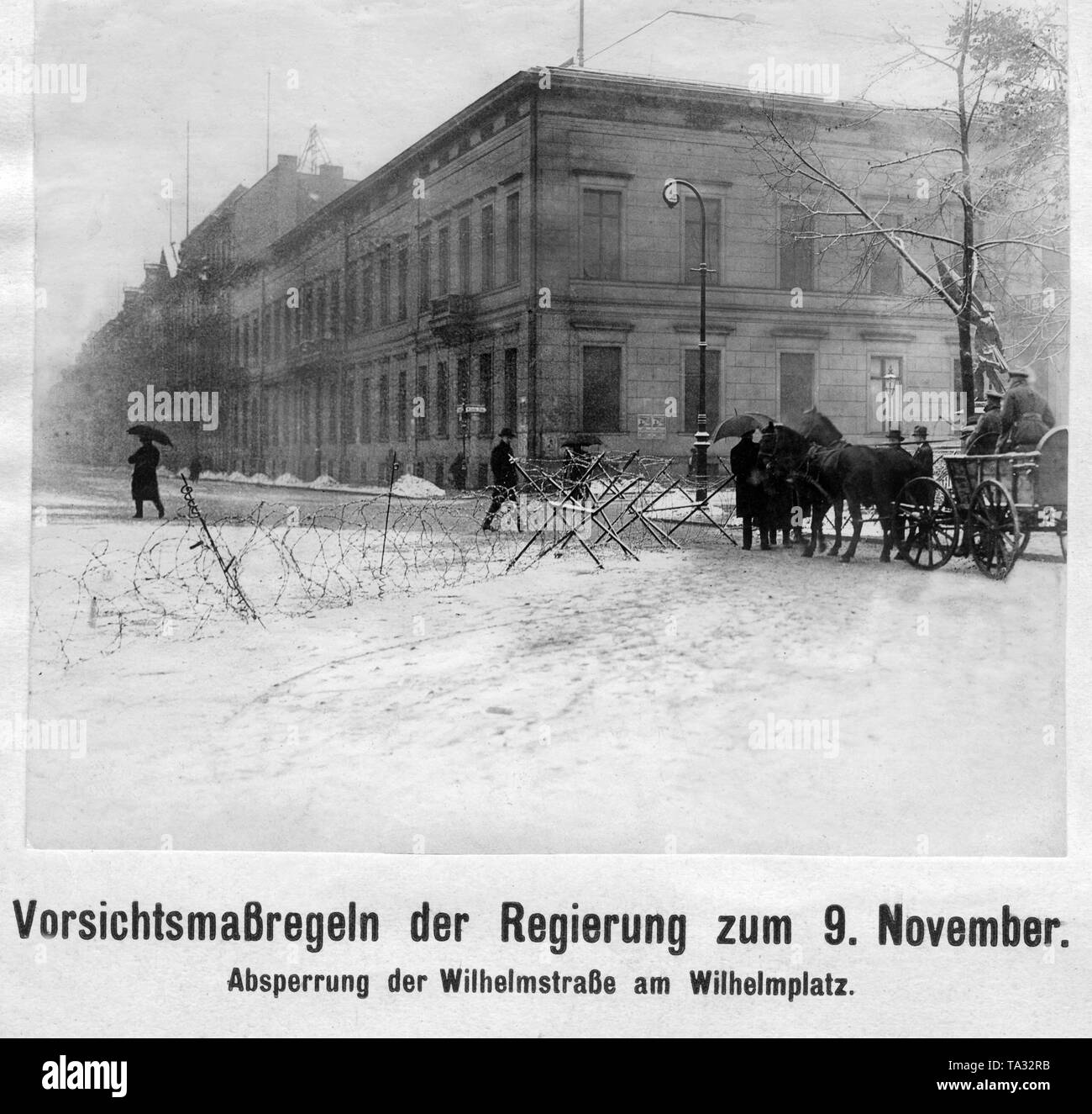 Roadblock at Wilhelmstrasse on Wilhelmplatz in Berlin on 09.11.1919, the anniversary of the revolution. On the right, a horse cart with two soldiers. Stock Photo