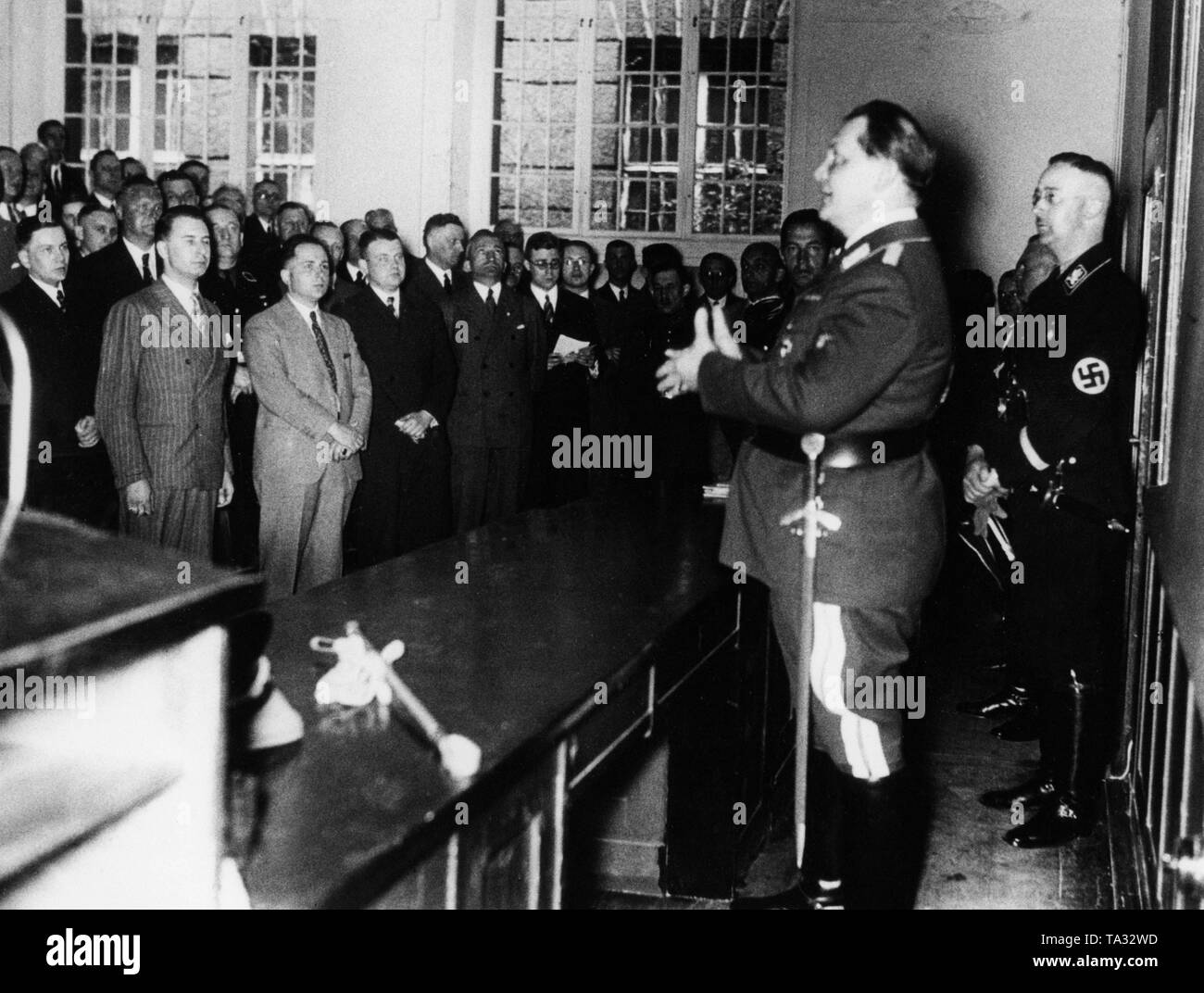Hermann Goering speaks to the officials of the Secret State Police (Gestapo) on the occasion of the appointment of Reichsfuehrer SS Heinrich Himmler (right) as head of the Geheime Staatspolizei (Secret State Police) in May 1934th Stock Photo
