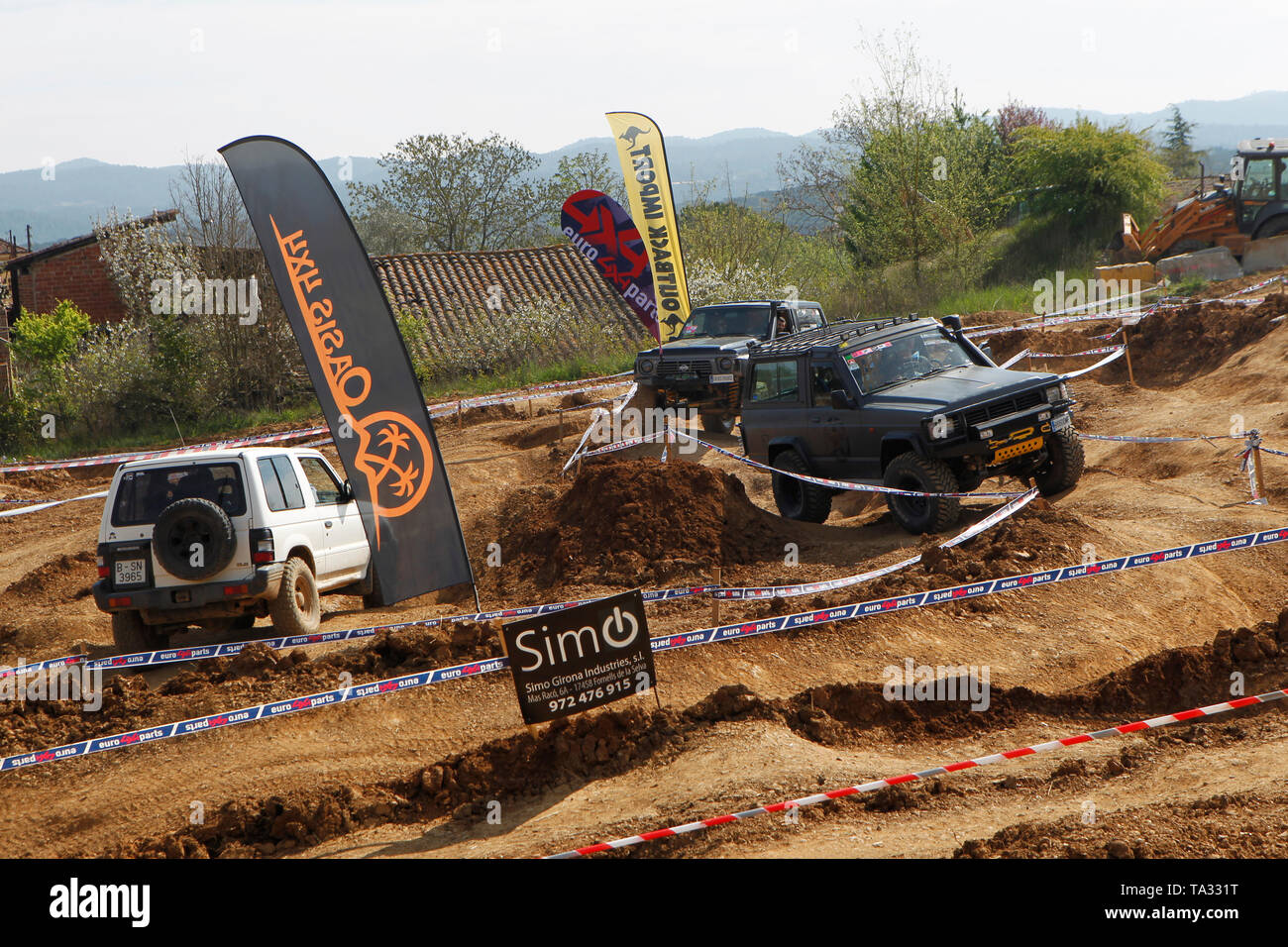 Four wheel drive cars tackling a mud circuit in Spain Stock Photo