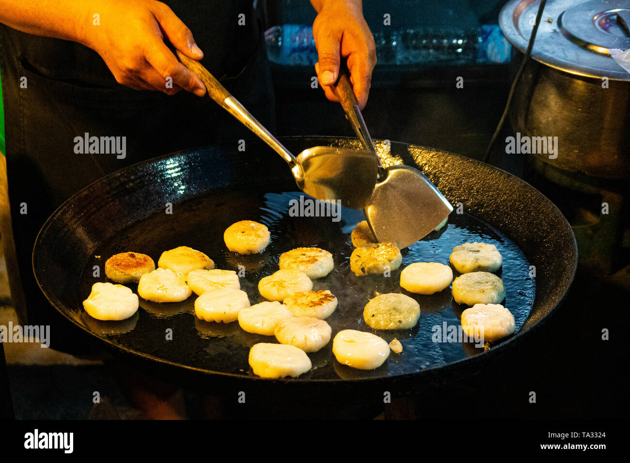 Vegan Dim Sum fried in a Thai Pan, Street food on Phuket Island during the Vegetarian Festival in Thailand, Asia Stock Photo