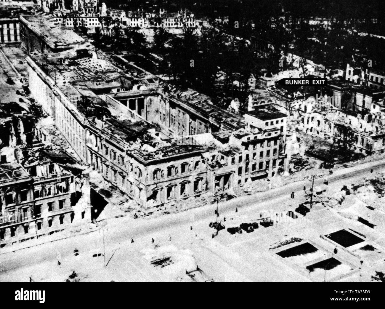 Photo of the entire site of the destroyed Reich Chancellery in Berlin, taken in the summer of 1945. The exit to the 'Fuehrerbunker' is marked at the top on the right. Stock Photo