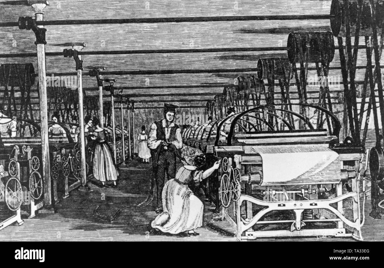 Women's work in the industry of the 19th century. Women work on mechanical looms. Stock Photo