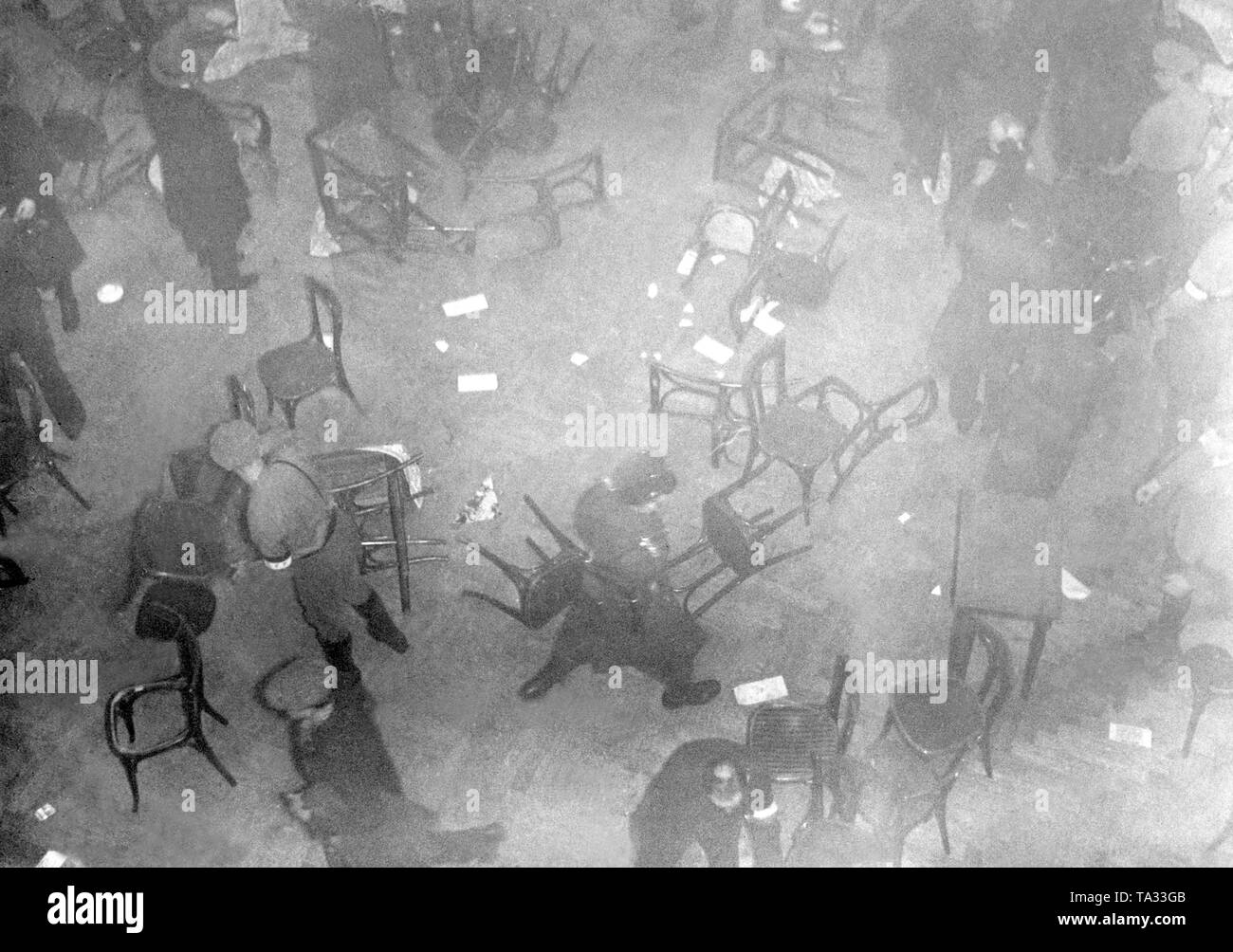 The police intervenes in the fight between political parties in the 'Neue Welt', a restaurant in the Hasenheide in Berlin. The clashes between opposing parties with the help of raiding parties became common in the big cities starting 1931. Stock Photo