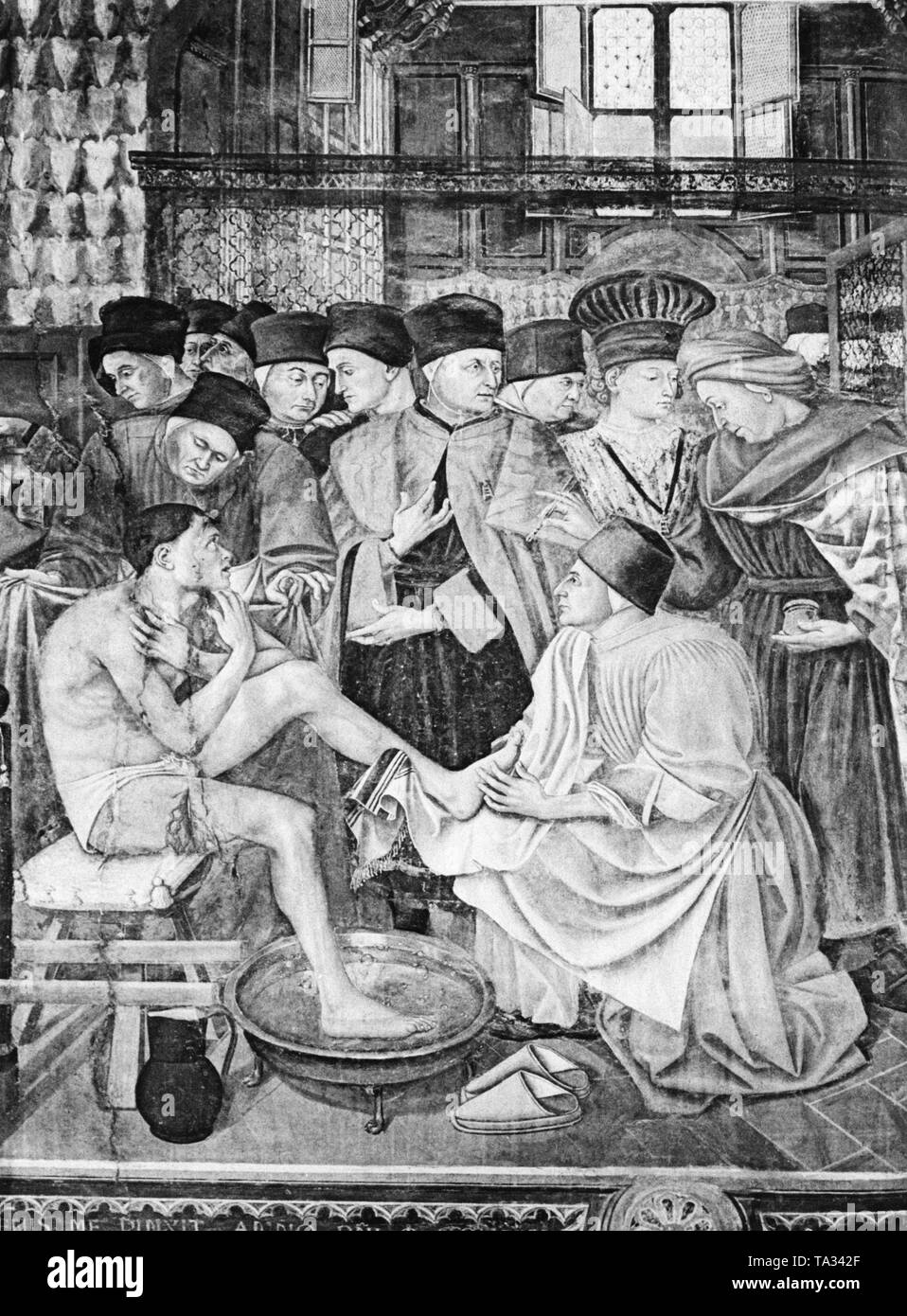 An injured man is being treated in an infirmary at the time of the Italian Renaissance. Undated photo, around 1420-1500. Stock Photo