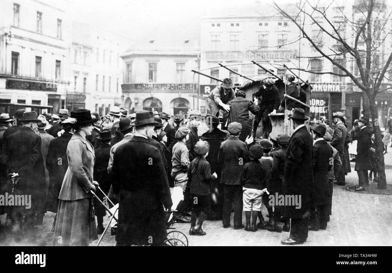 Voters travel by car to vote on the country. In this photo the voters climb onto the loading area of a truck before the departure to the place of voting. Stock Photo