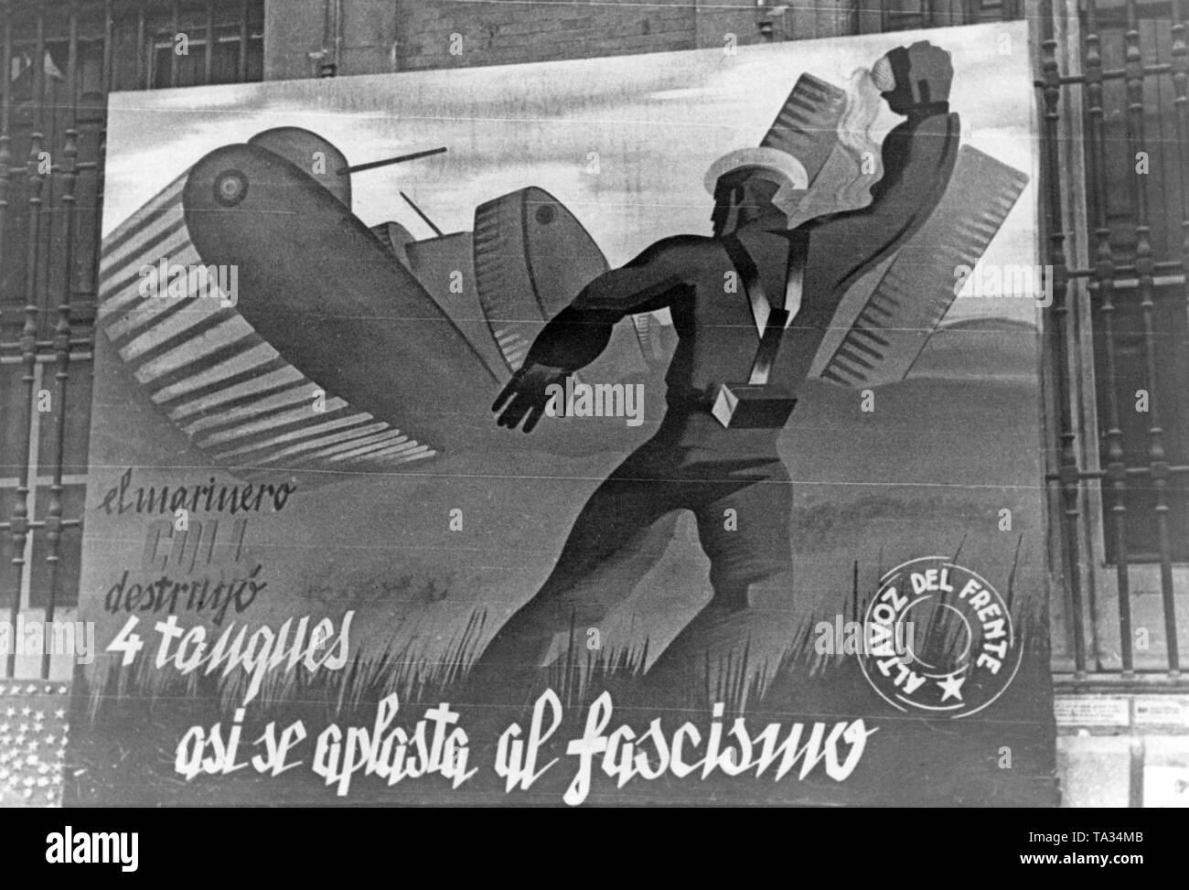 Photo a poster of the 'Lautsprecher der Volksfront' ) ('Loudspeaker of the People's Front') that was suspended in the streets of Madrid to promote acceptance for the war against the Spanish national faction. The poster shows a sailor who throws a grenade on a tank: 'sailor Coll destroyed four tanks, so we crunch Fascism. ' Stock Photo