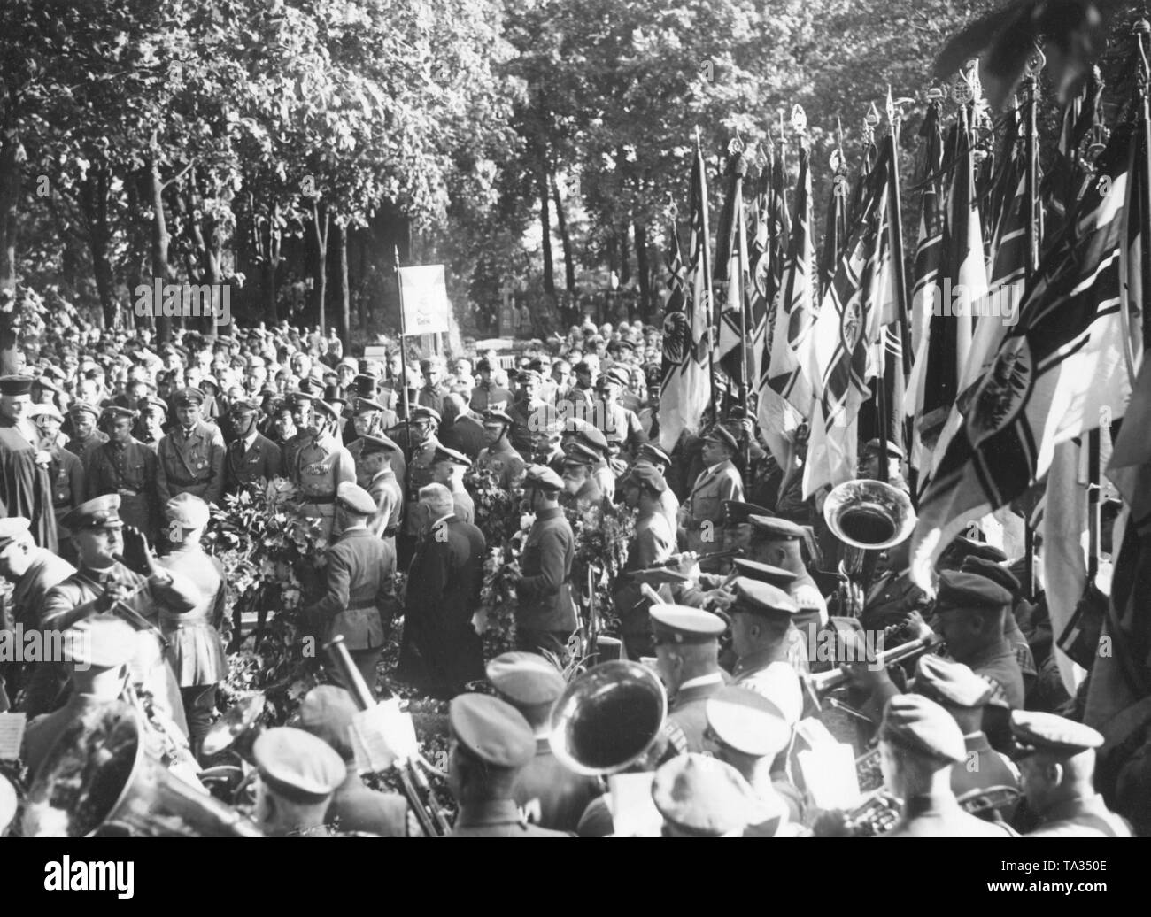 At the funeral of the Stahlhelm member Maurice August Hahn, who had been murdered by Communists, a mourning ceremony of the Stahlhelm was held in Friedrichsfelde cemetery. The deceased is honored with flags and a music band. Stock Photo