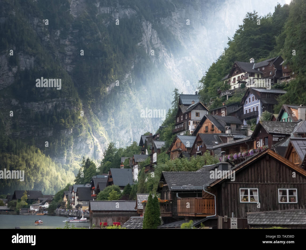 Sun shining through a valley in the alps Stock Photo