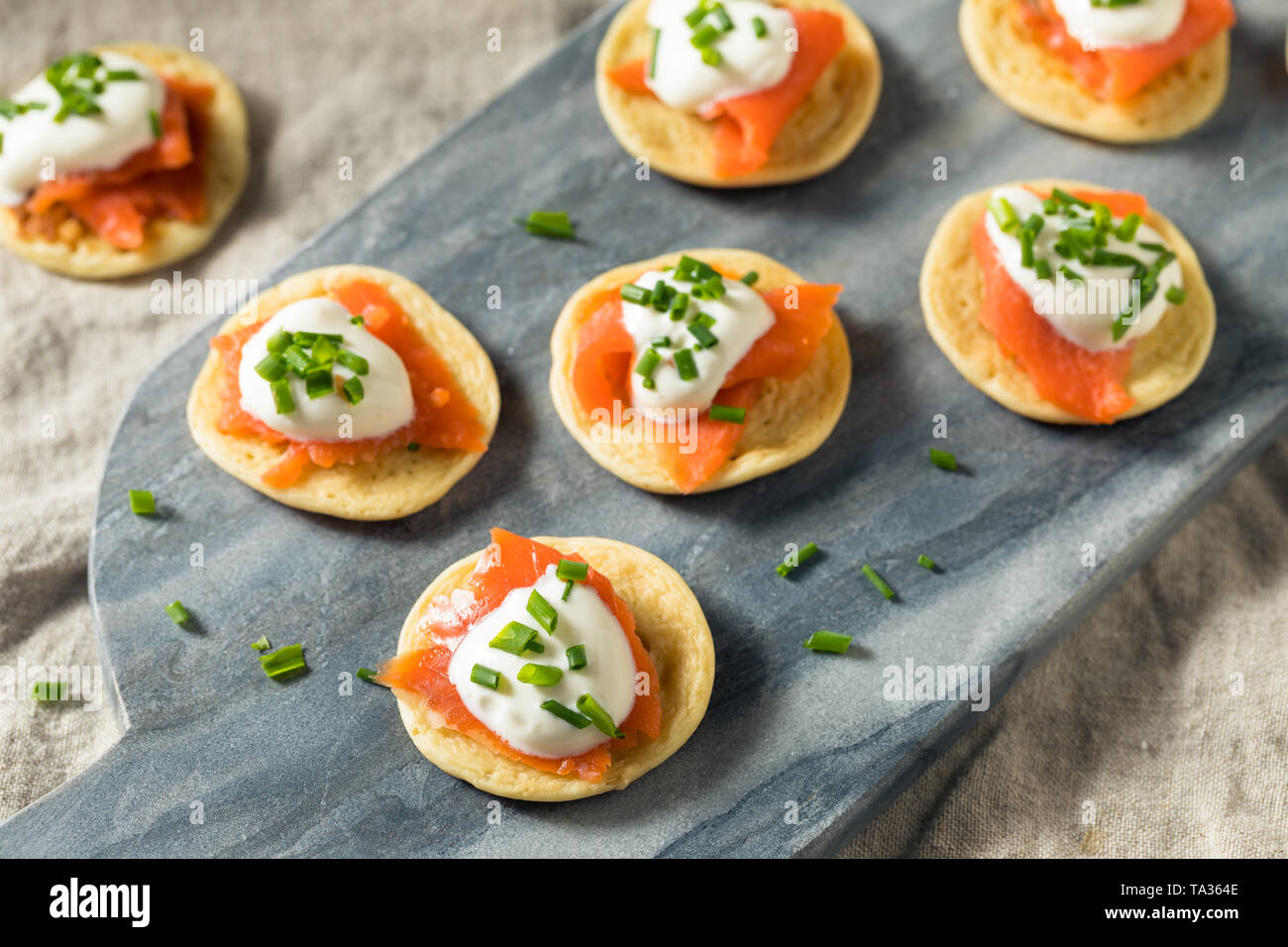 Homemade Smoked Salmon Cocktail Blinis with Creme and Chives Stock