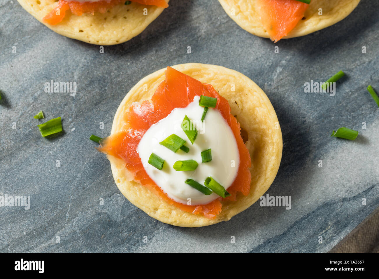 Homemade Smoked Salmon Cocktail Blinis with Creme and Chives Stock