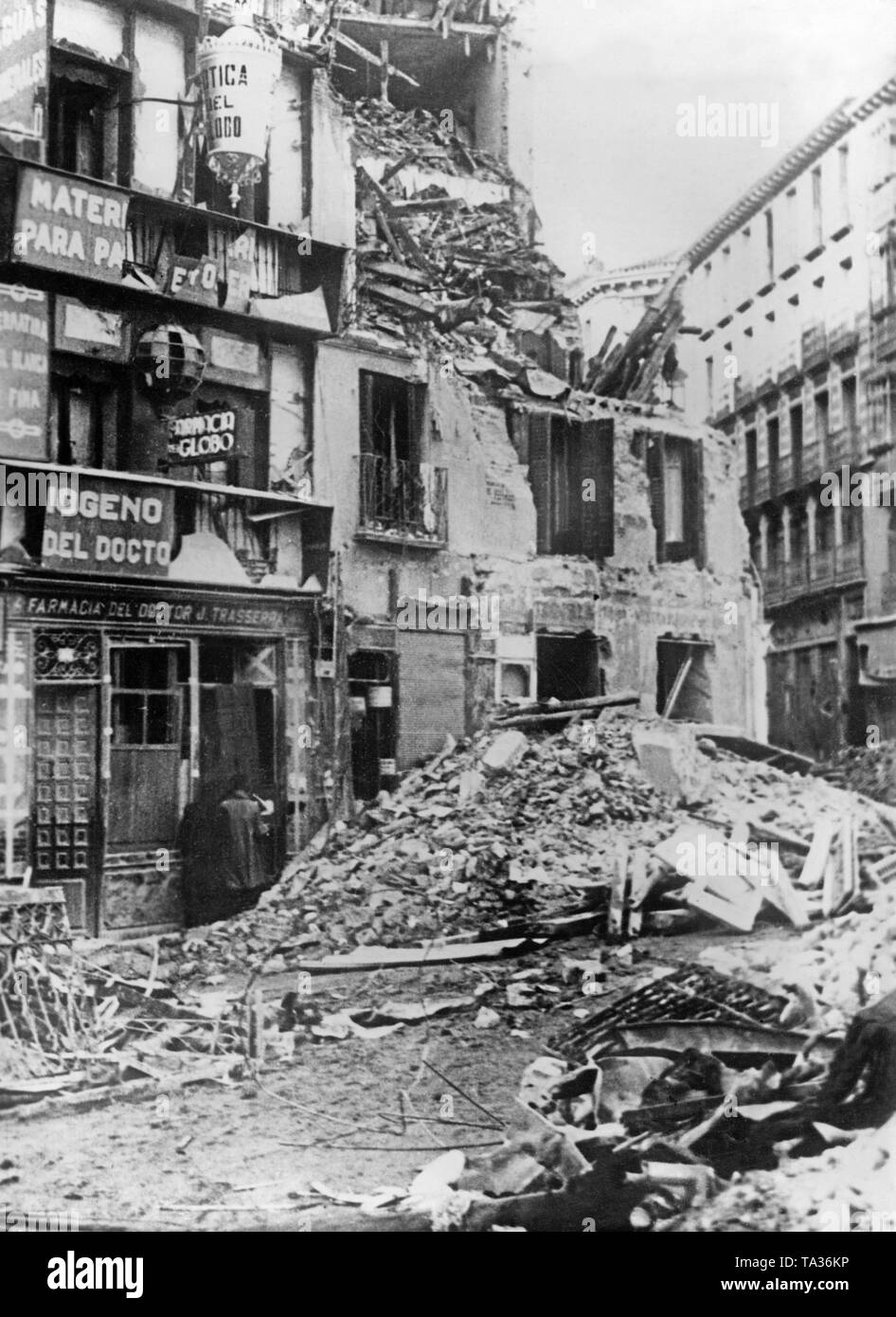 Photo of houses destroyed by shellfire at the Puerta del Sol in the center of Madrid during the siege of Madrid in the Spanish Civil War. Stock Photo