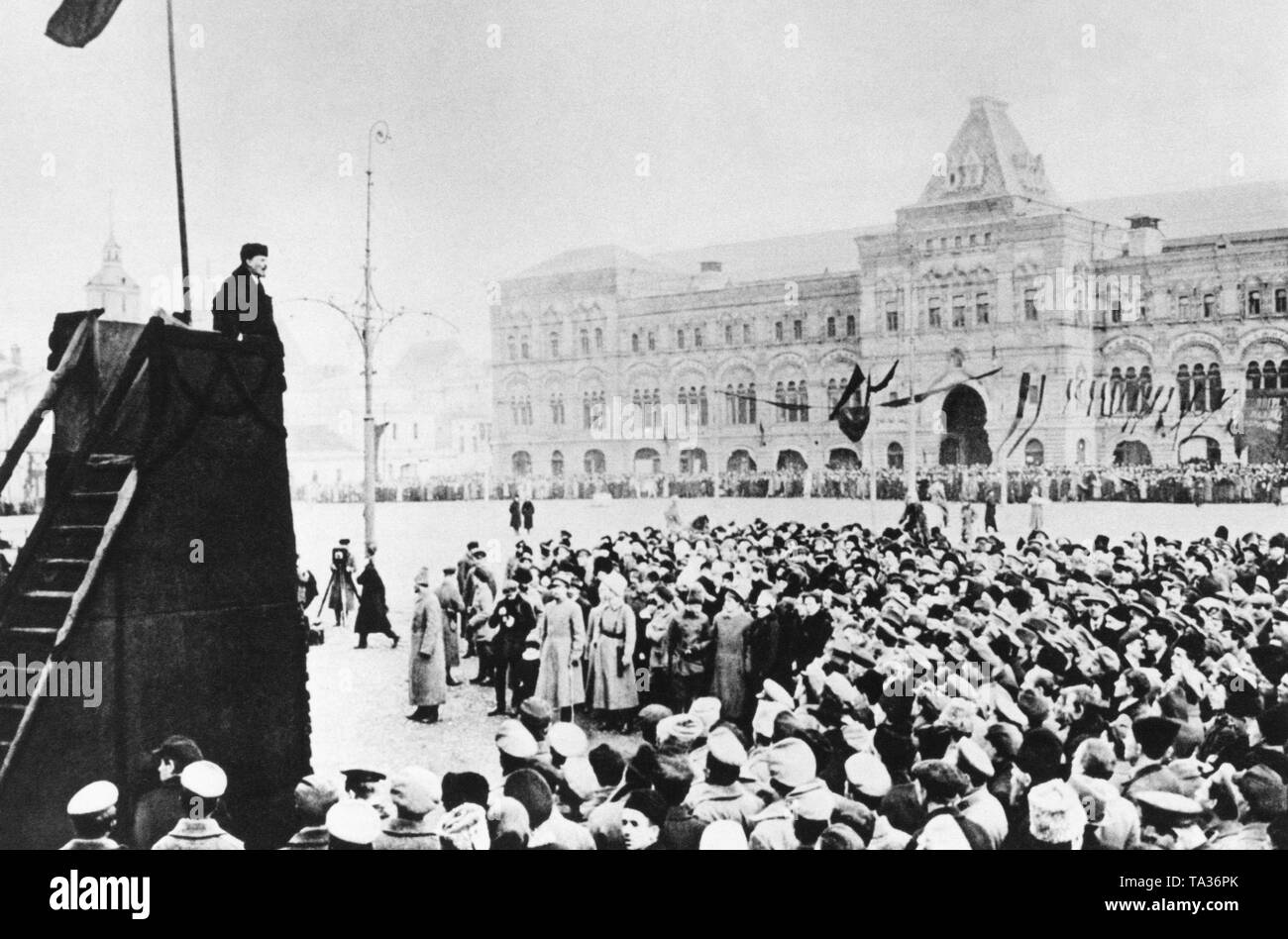 On the first anniversary of the October Revolution, Vladimir Ilyich Lenin is giving a speech to soldiers and party members at the Red Square in Moscow. Stock Photo