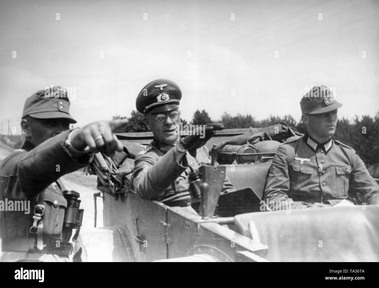 General of the Infantry and, at the same time, Divisional Commander (center) in a Wehrmacht vehicle. Photo: war correspondent Brenner. Stock Photo