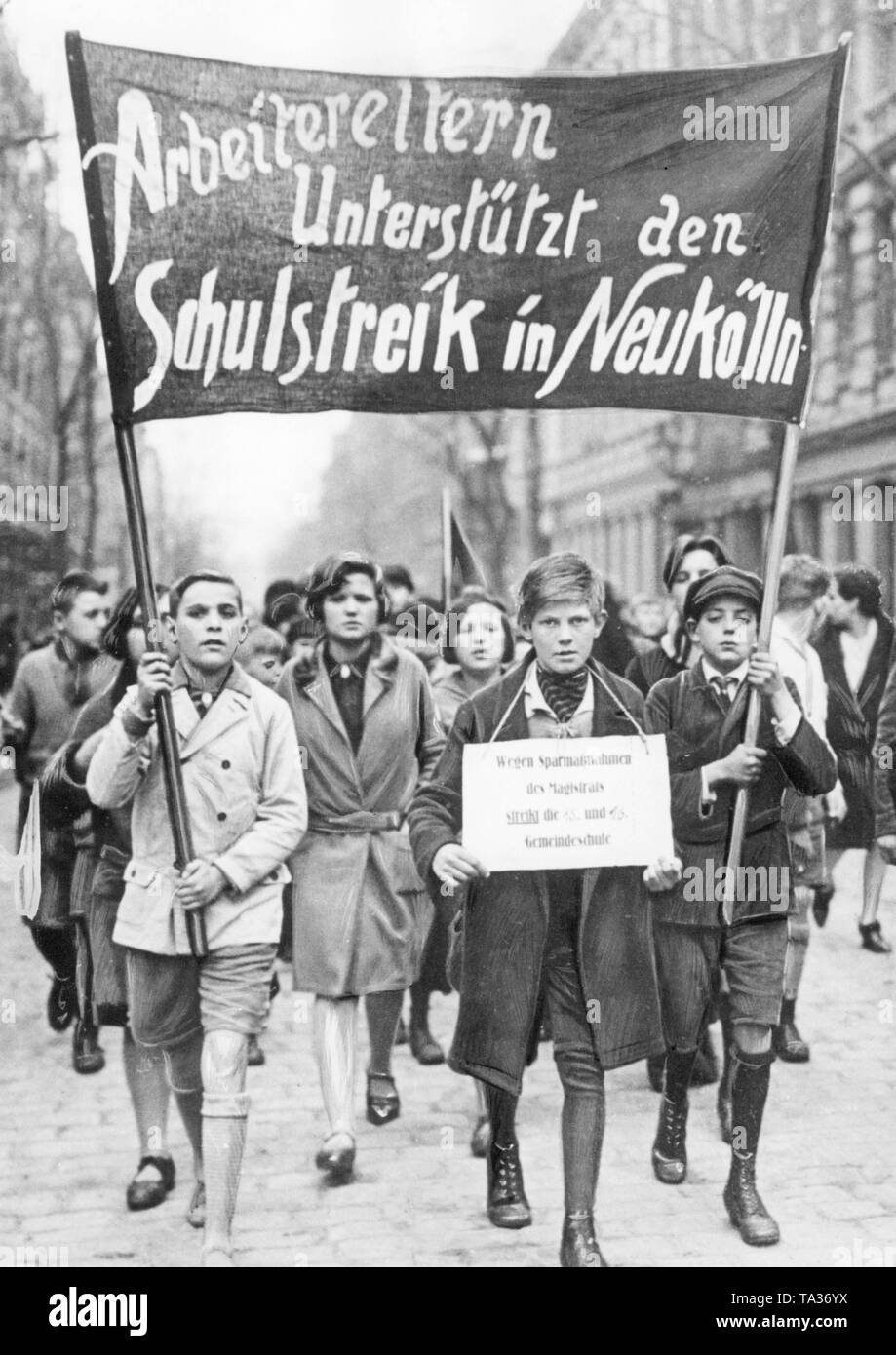 During the world economic crisis, students from the 15th and 16th community schools in the Neukoelln district of Berlin strike demanding in the interests of the KDP on a banner: 'Workers' parents support the school strike in Neukoelln'. Stock Photo