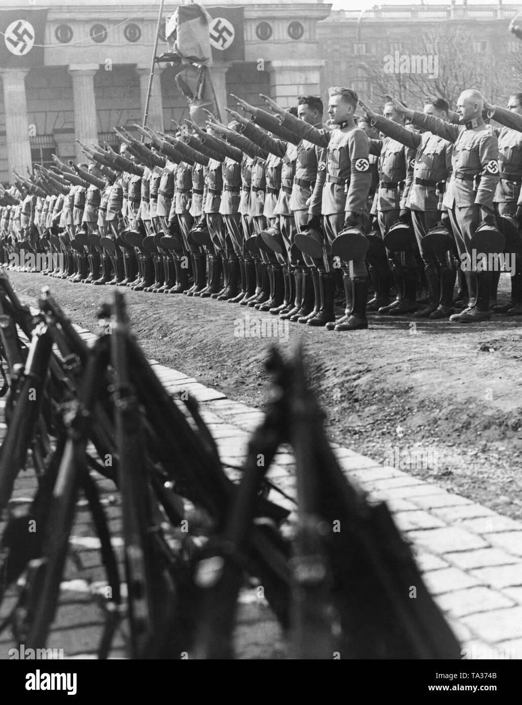 After the annexation of Austria to the German Reich, the Austrian police is sworn in to Adolf Hitler. The police formations take the oath on the Heldenplatz in Vienna. Stock Photo