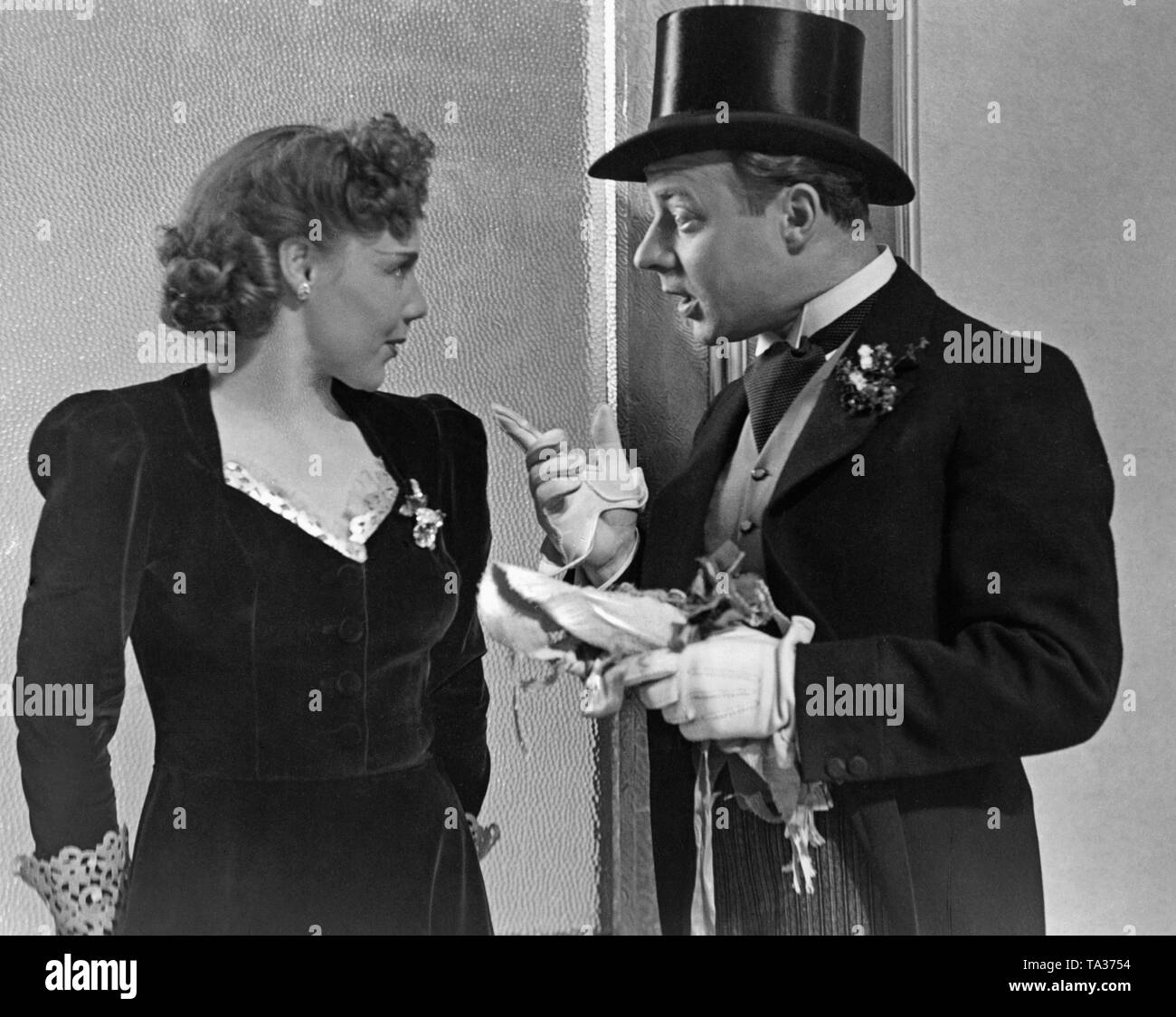 Heinz Ruehmann as Fred Holmes and Alexa von Porembsky as Clara in the  comedy "The Leghorn Hat", directed by Wolfgang Liebeneiner.The comedy is  based on the play "The Italian Straw Hat" by