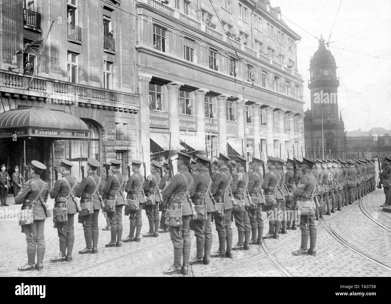 The British leave their headquarters in Cologne by lowering flags and a last parade with fixed bayonets. Stock Photo