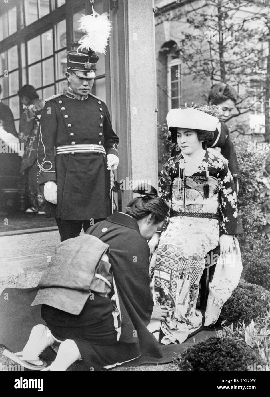 On May 18, 1933, the nineteen-year-old daughter Kaoru Araki (right) of the Japanese War Minister Sadao Araki, prepares for her wedding with Hideo Shiabu in Tokyo. Stock Photo