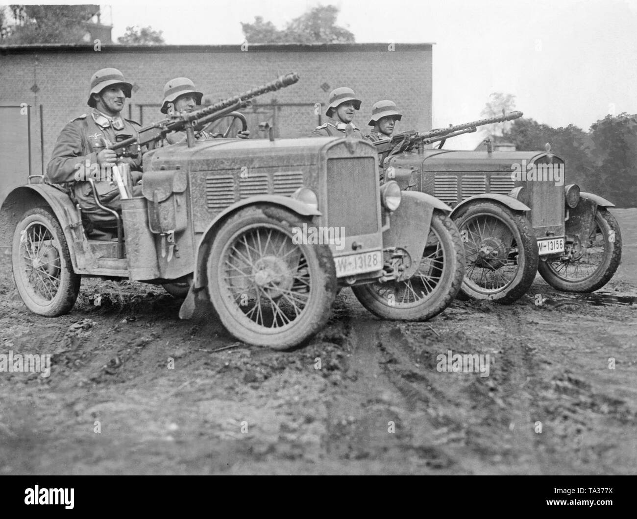 Two small cars with mounted machine guns. Stock Photo