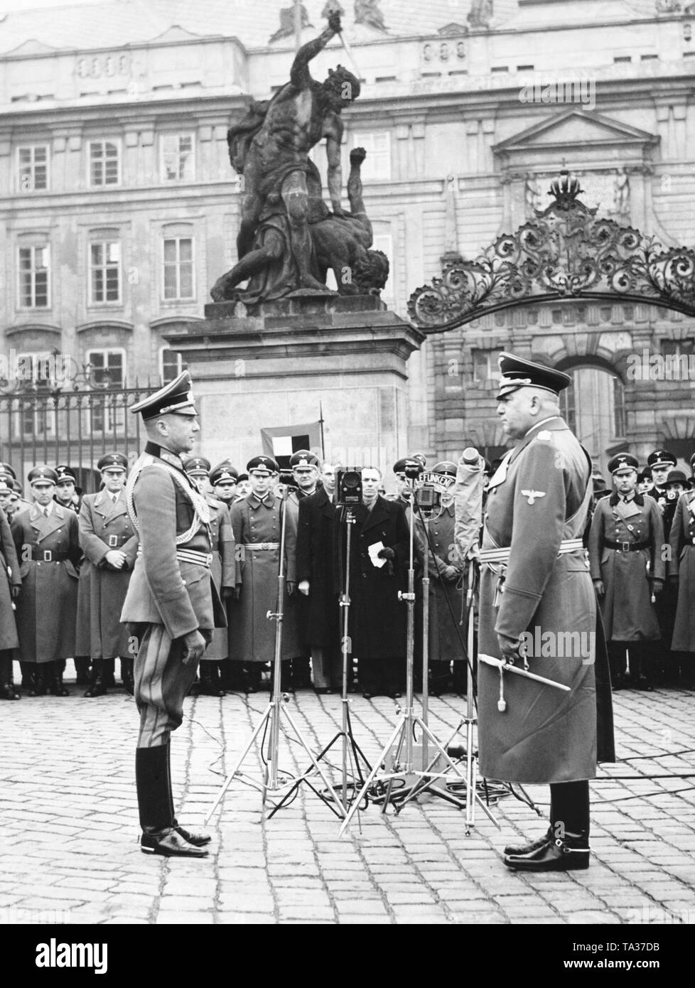 General Walther von Brauchitsch hands over the Protectorate of Bohemia and Moravia to the Reich Protector, Konstantin von Neurath, in front of the Prague Castle. In March 1939, the Wehrmacht occupied the Czech Republic and the First Slovak State was established by Hitler's command. Stock Photo