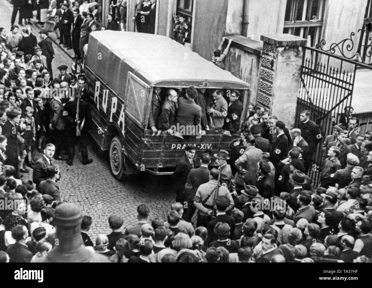 Scene of a mass arrest of anti-fascist Sudeten Germans and Czech officials in As, the Sudetenland in 1938, carried out by the Sudeten German army with swastika armbands. Stock Photo