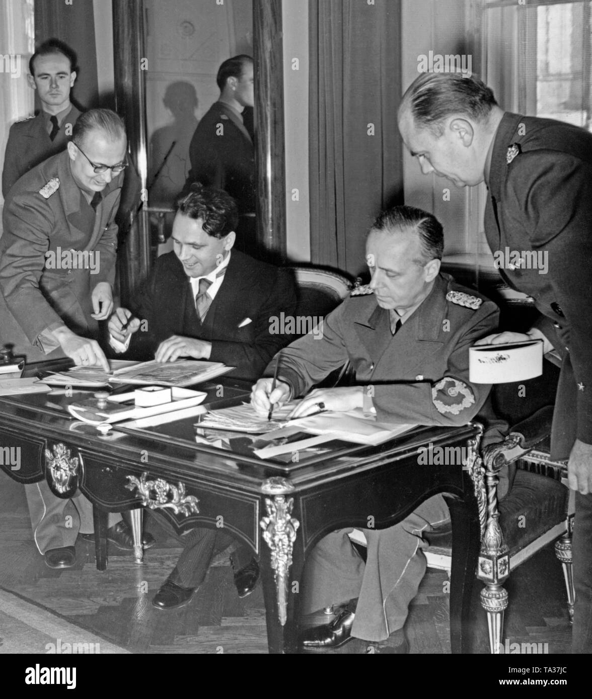 Matus Cernak (2nd from left) and Joachim von Ribbentrop (2nd from right) sign the German-Slovakian Treaty at the Federal Foreign Office in Berlin. To Cernak's left, Envoy Heinburg and to Rippentrop's right, Envoy Schmidt. The first Slovak Republic was founded on Hitler's command in March 1939, and Bohemia and Moravia were occupied by the Wehrmacht. Stock Photo