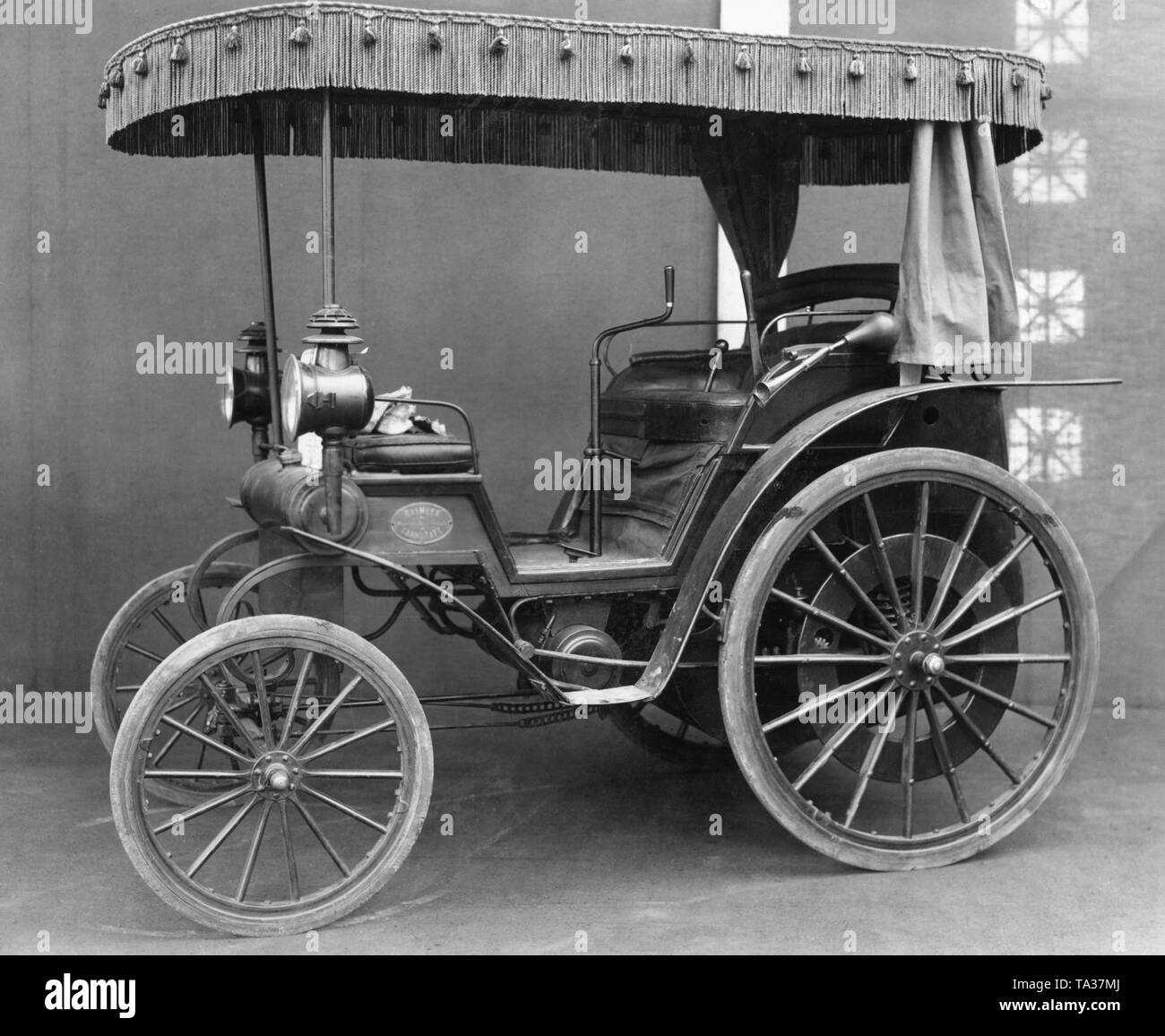 A four-wheeled motor car by Gottlieb Daimler from 1894. Stock Photo