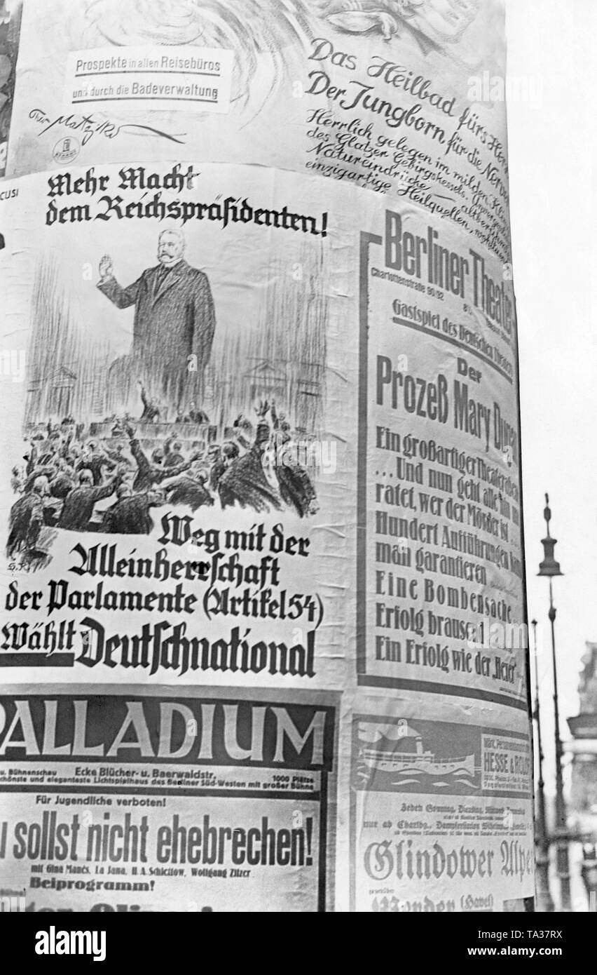 An ??election poster of the DNVP (German National People's Party)  on an advertising column for one of the two Reichstag elections in 1932. Reich President Paul von Hindenburg is seen as an oversized figure before parliamentarians. The appeal reads: 'More power to the President of the Reich! Away with the autocracy of the parliaments (Article 54). Vote for the German National! ' Stock Photo