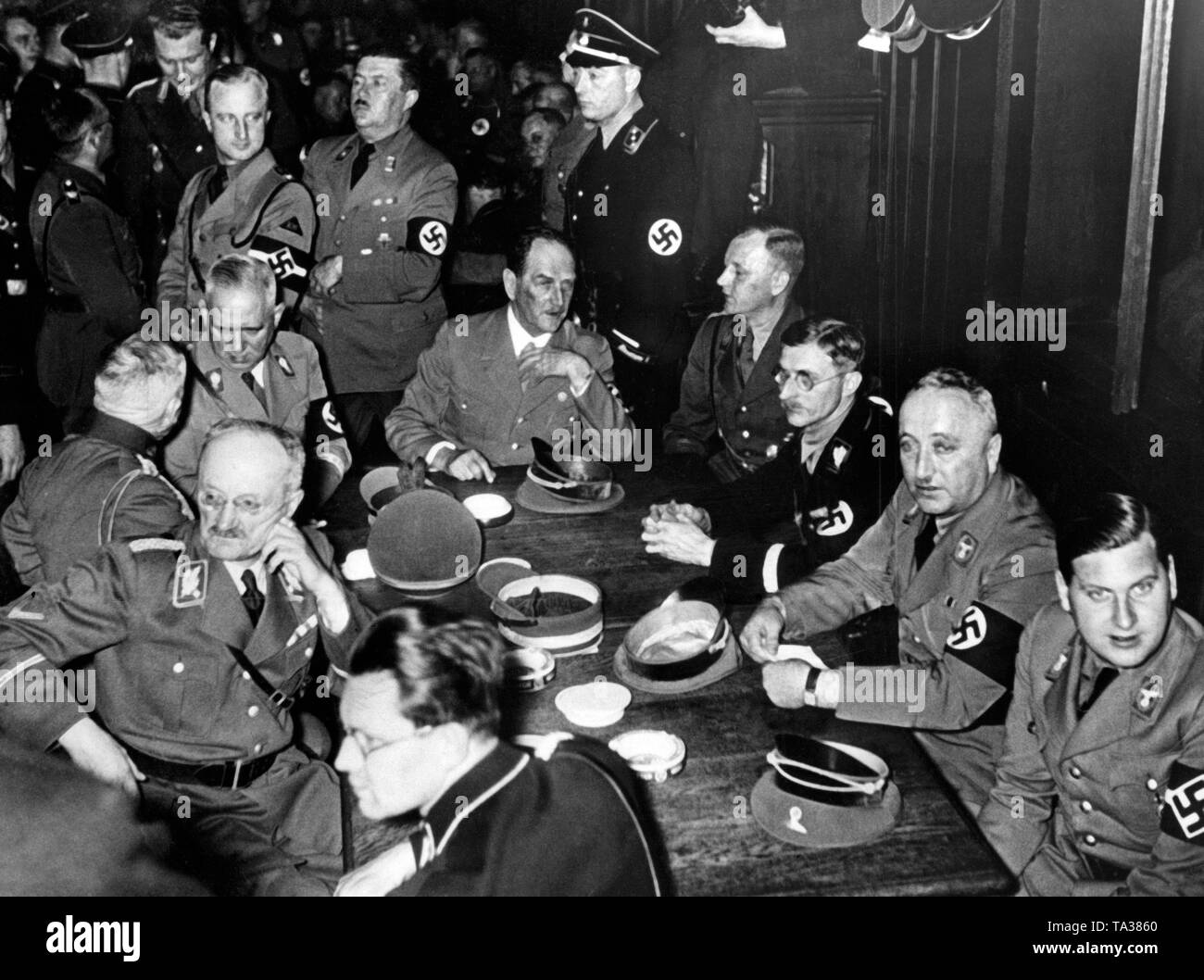 This recording shows the reunion of the 'Alter Kaempfer' (Old fighters) in the large hall of the Hofbraeuhaus in Munich. In the foreground at the table from right: Reich Youth Leader Baldur von Schirach, the leader of the German Labor Front (DAF) Robert Ley, the Munich Lord Mayor and Reichsleiter Karl Fiehler, Reich Governor of Bavaria Franz Ritter von Epp and the Bavarian Minister President and SA Gruppenfuehrer Ludwig Siebert. The 'Alter Kaempfer' was a designation of NSDAP party members who have joined the party before 1933. Stock Photo