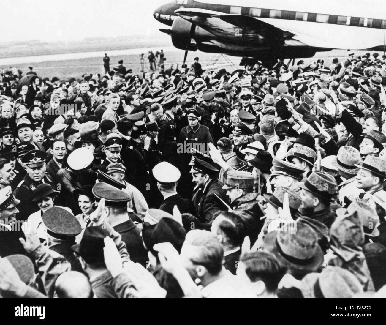 Reception of the crew of a Focke-Wulf FW 200 Condor after a non-stop flight from New York to Berlin-Tempelhof. In the middle, the fighter pilot, aircraft designer and later Chief of Aircraft Procurement and Supply of the Luftwaffe, Ernst Udet. Stock Photo