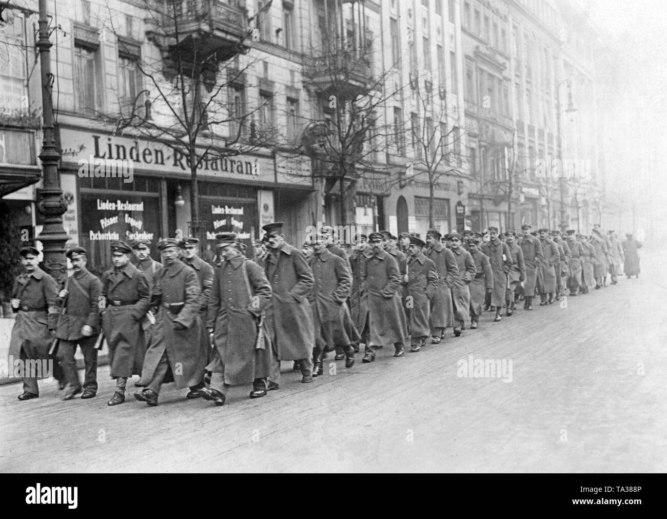 Soldiers of Freikorps units supported the Ebert government during the March fights against insurgent workers. The troop on this picture marches probably on the street 'Unter den Linden'. Stock Photo