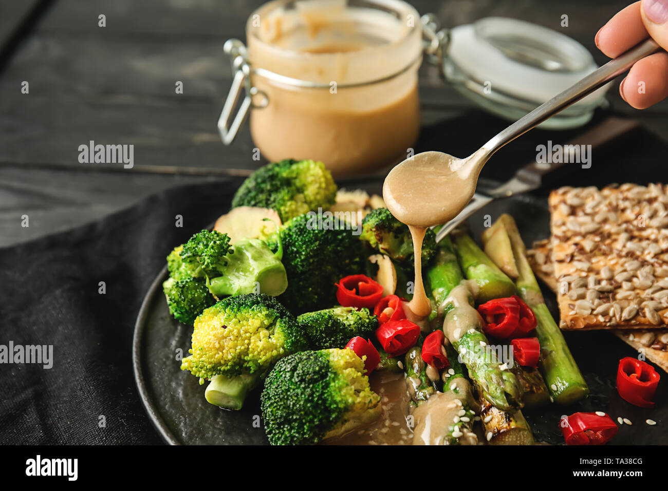 dressing-of-fresh-vegetables-with-tasty-tahini-on-plate-stock-photo-alamy